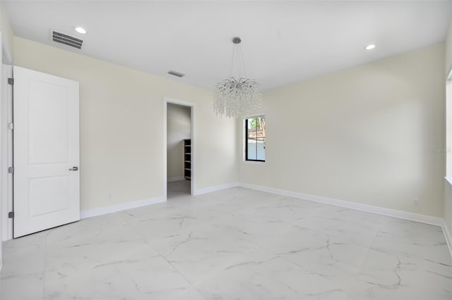 empty room with recessed lighting, visible vents, baseboards, and marble finish floor