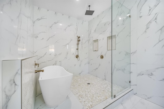 full bathroom featuring a marble finish shower, marble finish floor, and stone wall