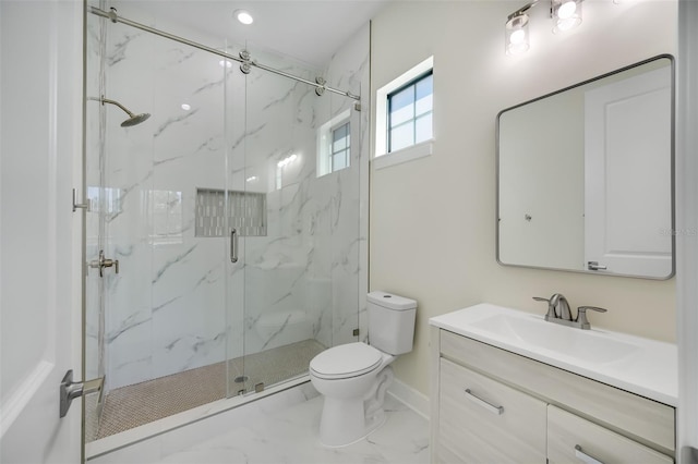 bathroom with a marble finish shower, baseboards, toilet, marble finish floor, and vanity