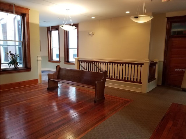 interior space with recessed lighting, baseboards, and wood-type flooring