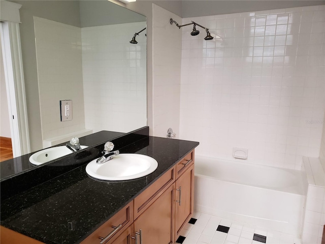 bathroom featuring vanity and shower / bath combination