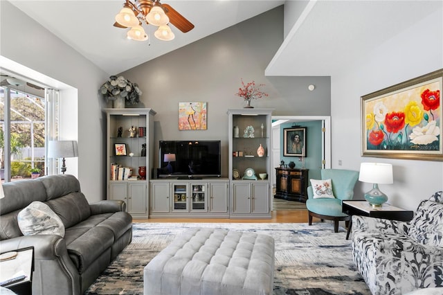 living room with lofted ceiling, wood finished floors, and ceiling fan