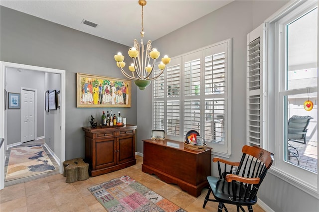 tiled office space with visible vents, baseboards, and an inviting chandelier