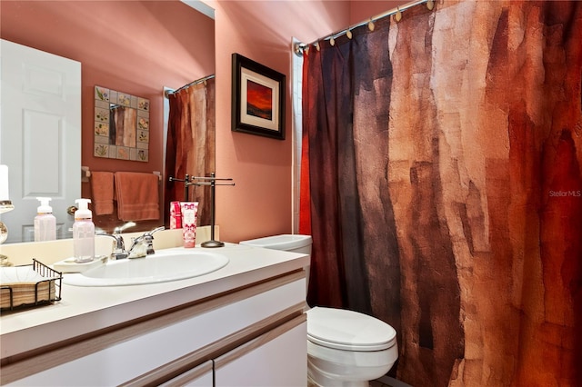 bathroom with a shower with shower curtain, toilet, and vanity