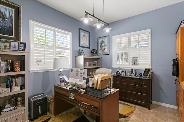 office area featuring baseboards