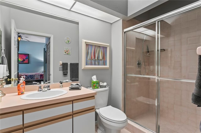 full bath featuring a shower stall, ensuite bath, vanity, and toilet