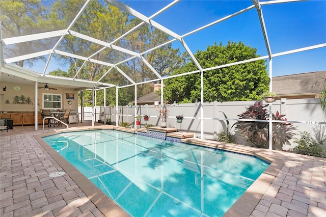 view of pool with a lanai, a fenced in pool, a fenced backyard, and a patio area