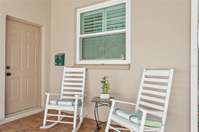 doorway to property with stucco siding