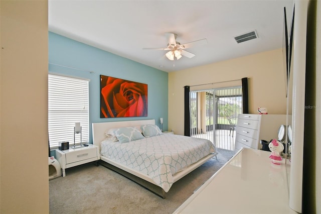 bedroom with visible vents, a ceiling fan, and carpet