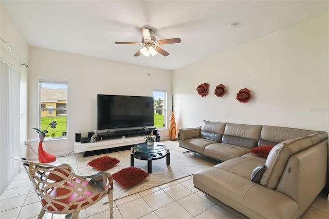 living room featuring light tile patterned floors, a wealth of natural light, and ceiling fan