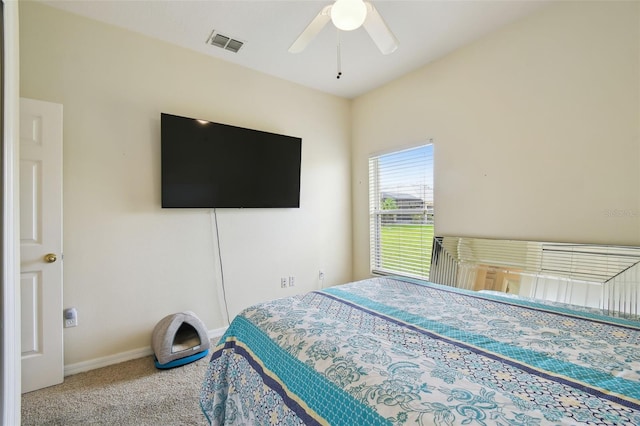 bedroom with visible vents, carpet floors, baseboards, and a ceiling fan