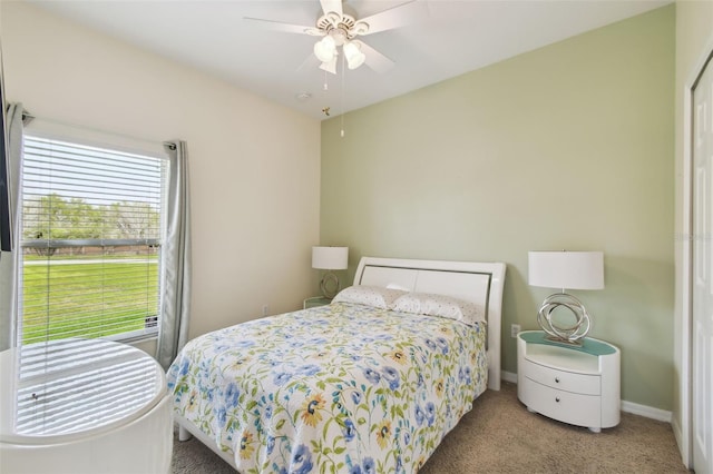 bedroom featuring baseboards, carpet floors, and ceiling fan