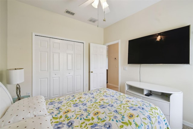 bedroom featuring a closet, visible vents, baseboards, and ceiling fan