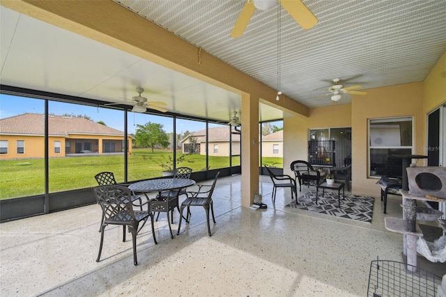 sunroom with a ceiling fan