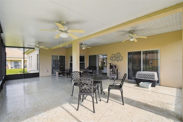 exterior space featuring a ceiling fan