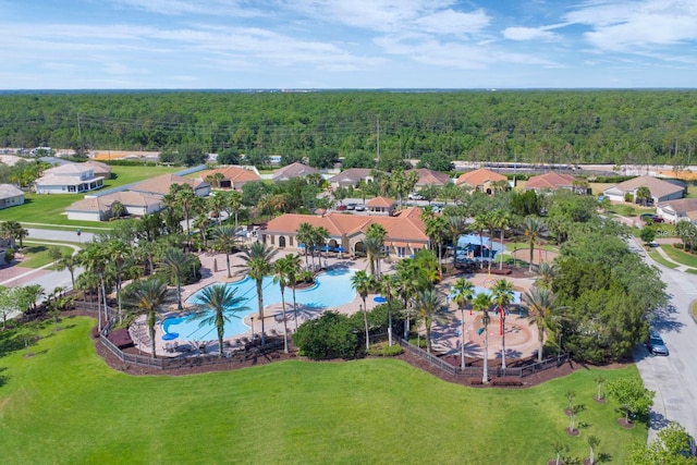 aerial view featuring a view of trees and a residential view