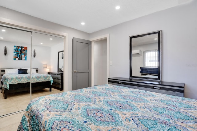 bedroom featuring tile patterned floors, recessed lighting, a closet, and a wall mounted air conditioner