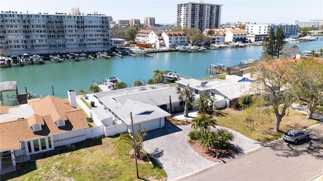 drone / aerial view featuring a water view and a view of city