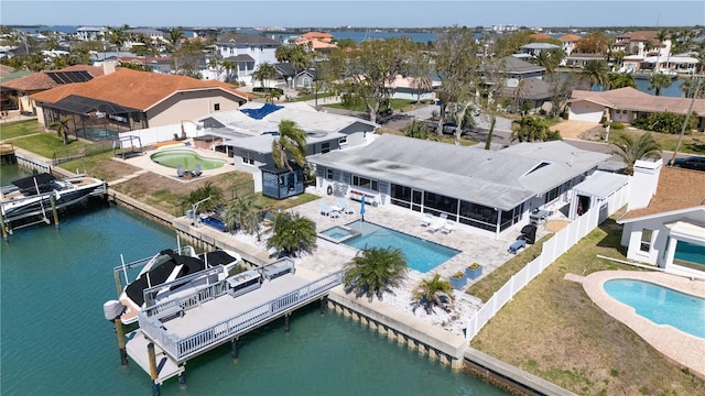 aerial view featuring a residential view and a water view