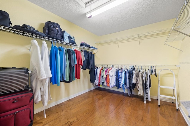 spacious closet with wood finished floors