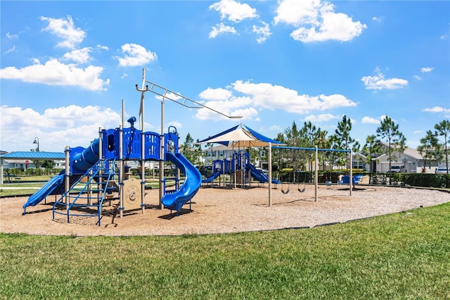 communal playground featuring a yard
