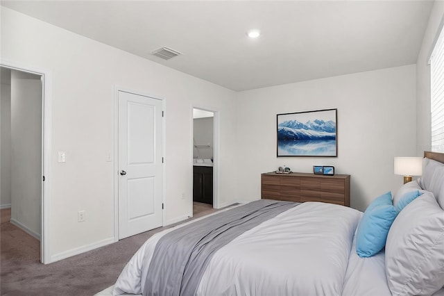 bedroom featuring ensuite bathroom, light colored carpet, baseboards, visible vents, and recessed lighting