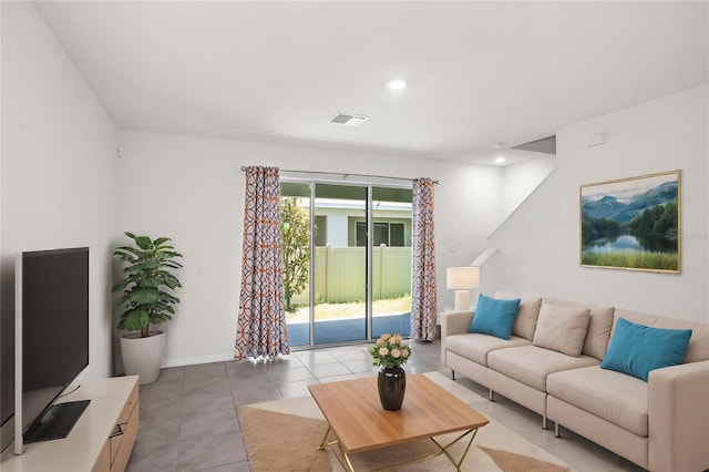 living area with baseboards, visible vents, recessed lighting, and light tile patterned floors