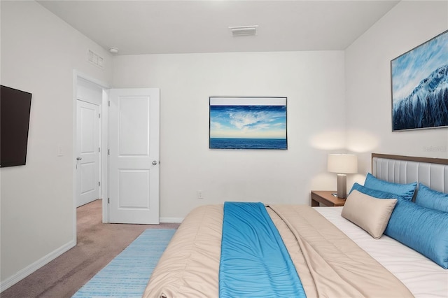 bedroom with visible vents, baseboards, and carpet flooring