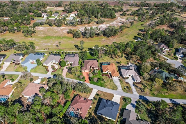 birds eye view of property with a residential view