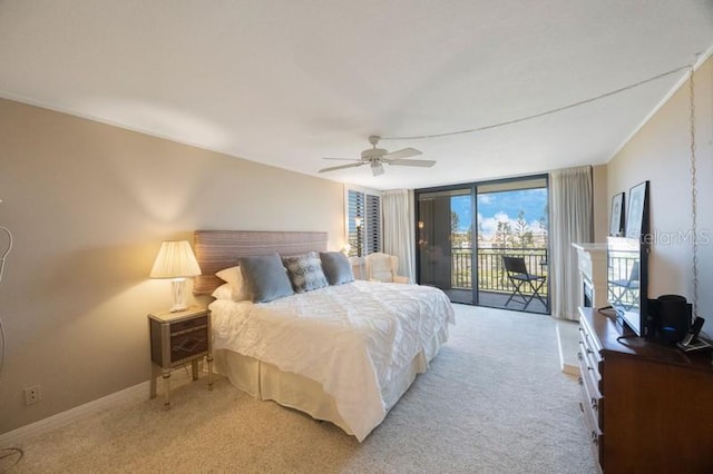 5700 Escondida Blvd S Unit 506, Saint Petersburg, FL 33715 - bedroom with light carpet, baseboards, access to outside, and expansive windows