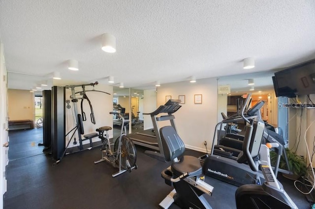 5700 Escondida Blvd S Unit 506, Saint Petersburg, FL 33715 - workout area with baseboards and a textured ceiling