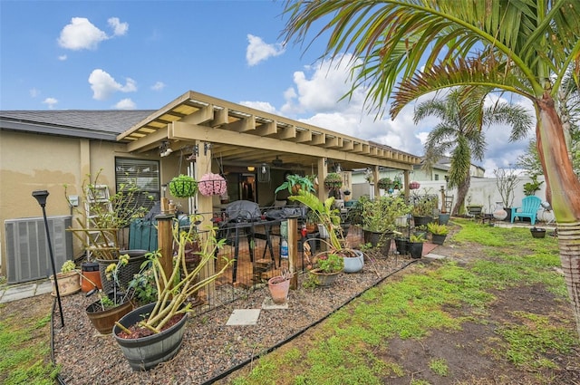 exterior space featuring central AC unit, a vegetable garden, and fence