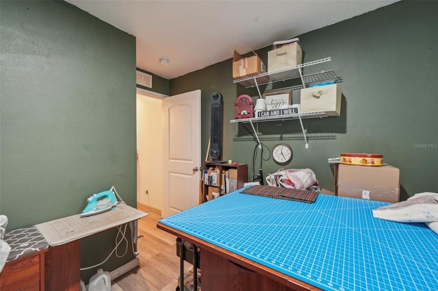 bedroom with wood finished floors and visible vents