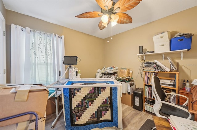 office space with ceiling fan and wood finished floors