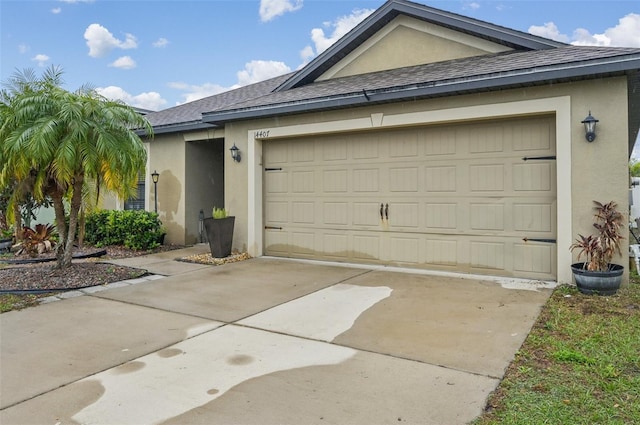 view of property exterior with a shingled roof, driveway, and stucco siding