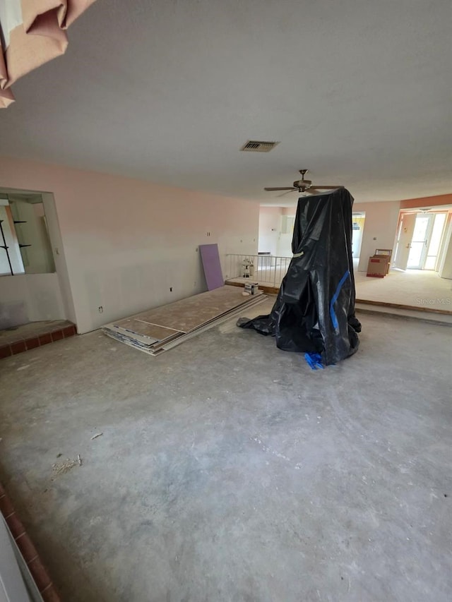 interior space with visible vents and unfinished concrete flooring