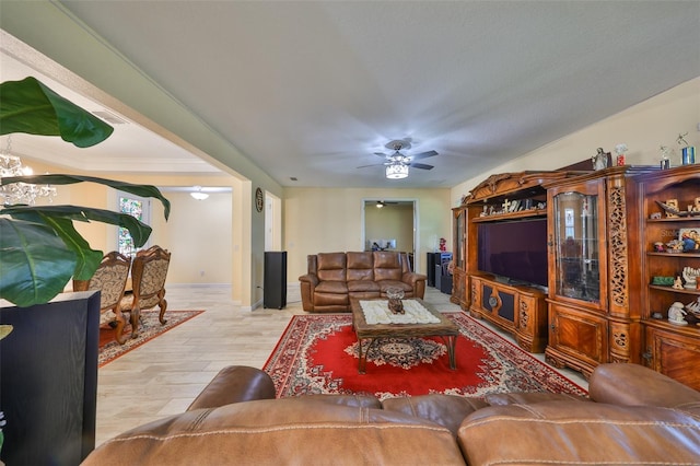 living area featuring wood finished floors and a ceiling fan