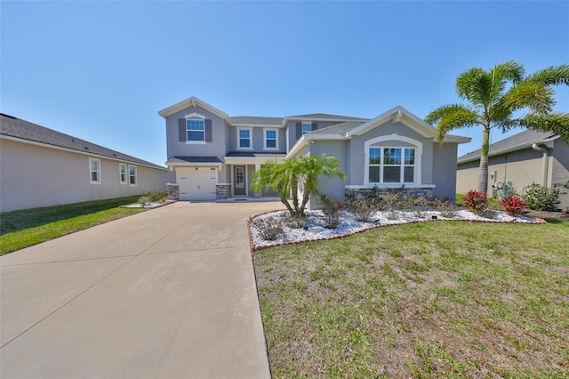 view of front of house featuring a garage, stucco siding, driveway, and a front yard