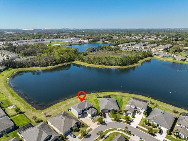 birds eye view of property with a residential view and a water view