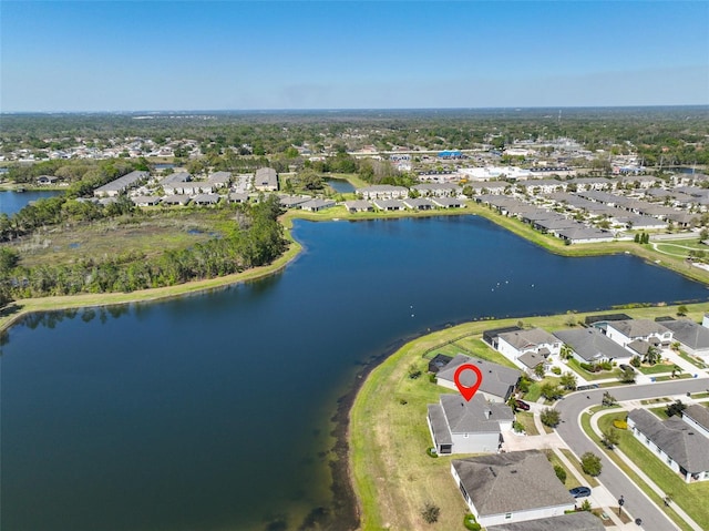 bird's eye view featuring a residential view and a water view