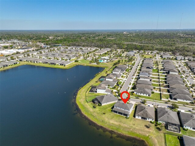 aerial view with a residential view and a water view