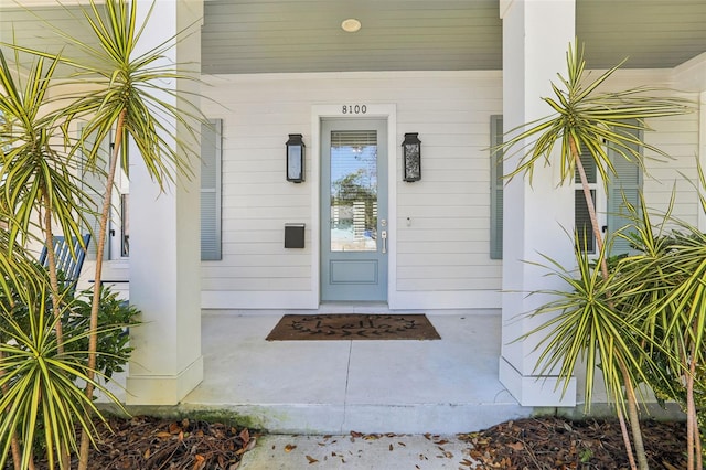 entrance to property with a porch