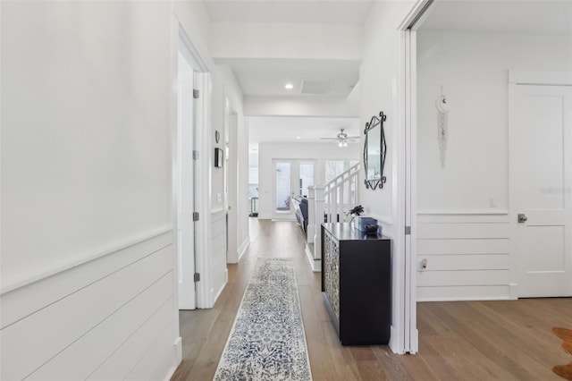 hall featuring stairway and light wood-style flooring