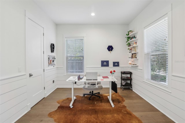 home office featuring recessed lighting, a wainscoted wall, and wood finished floors