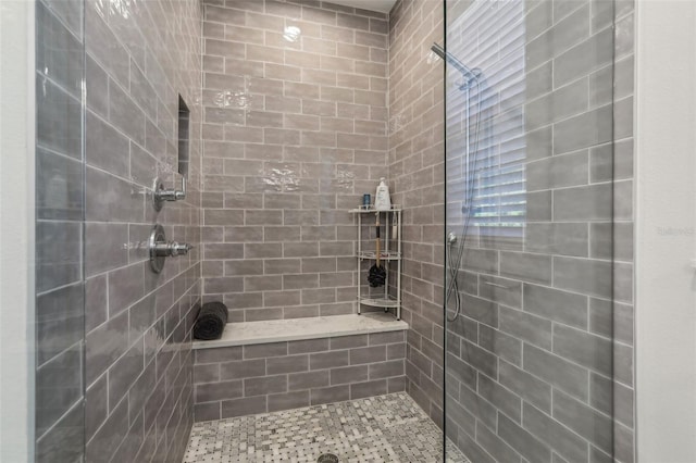 full bath featuring tiled shower