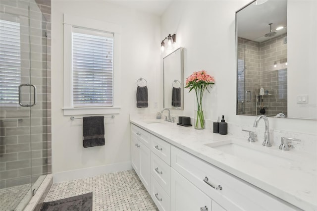 full bathroom featuring a sink, baseboards, and a stall shower