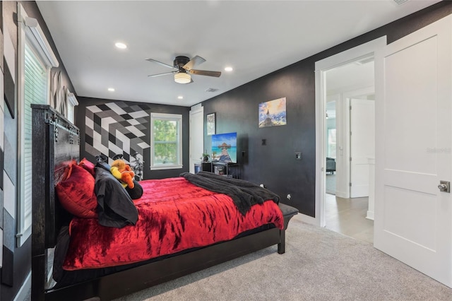 carpeted bedroom with recessed lighting, visible vents, a glass covered fireplace, and a ceiling fan