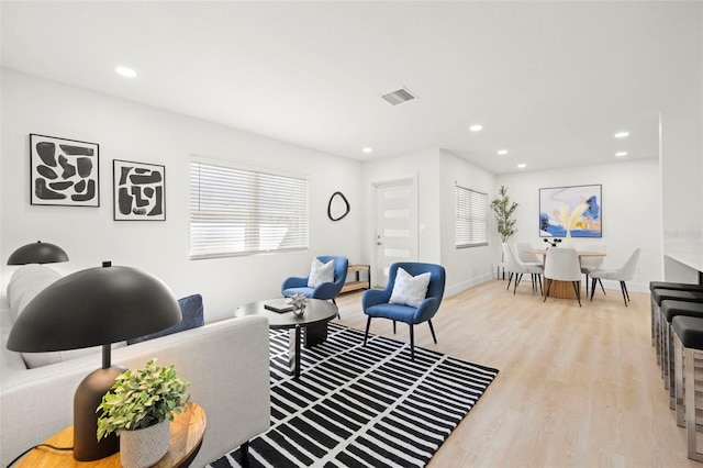 interior space featuring recessed lighting, visible vents, baseboards, and light wood-style floors