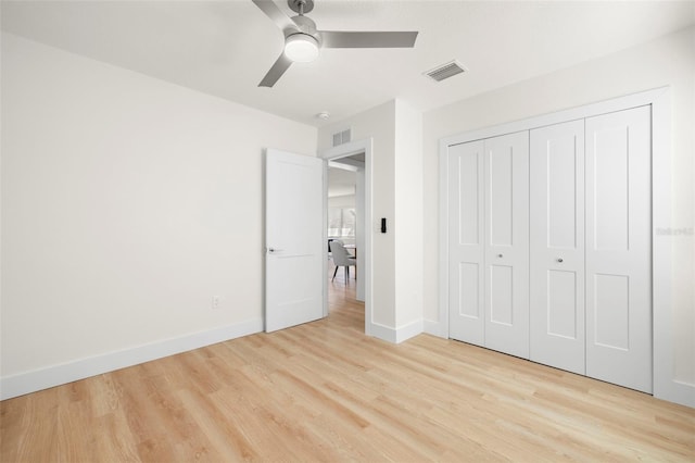 unfurnished bedroom featuring visible vents, baseboards, and light wood finished floors