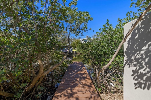 surrounding community with a boat dock